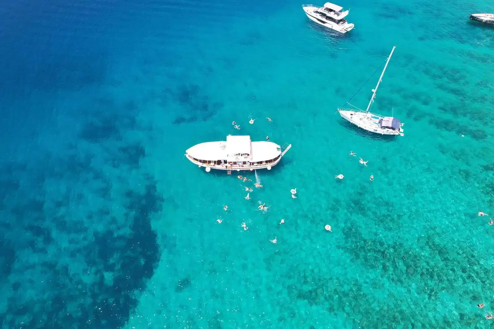 20-meter traditional wooden boat with canopy sun deck moored at Stobreč Harbor, ready for Blue Lagoon tour departures