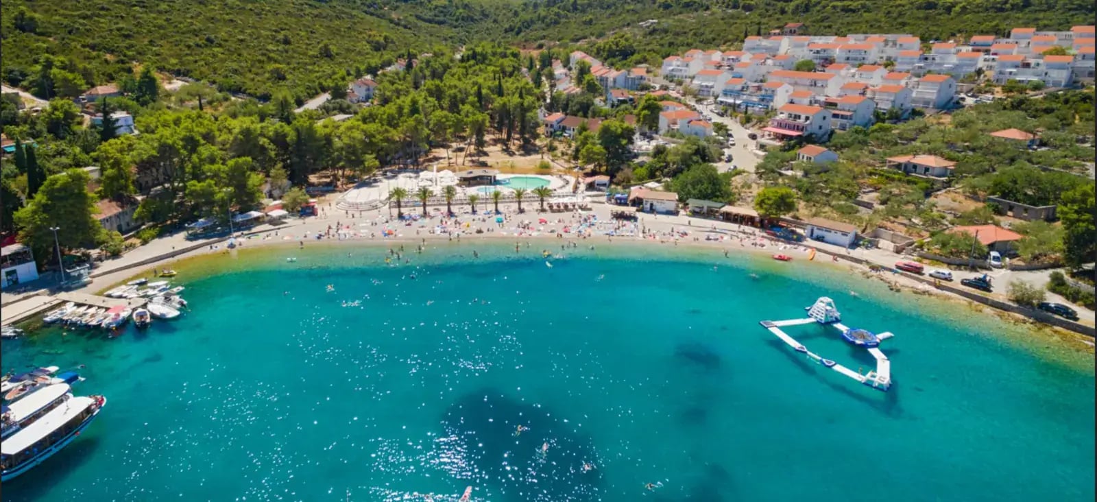 Nečujam Bay on Šolta Island with turquoise water and pine-covered shoreline